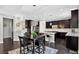 Well-designed kitchen with stainless steel appliances, granite countertops, and an island with seating, plus dining table at 4649 Spinning Wheel Dr, Brighton, CO 80601