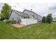 View of a fenced backyard and grassy area of the townhome community at 19249 E 58Th Ave # D, Denver, CO 80249