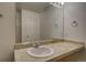 Bathroom featuring a large vanity, sink, mirror, and lighting at 19249 E 58Th Ave # D, Denver, CO 80249
