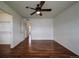 Bright bedroom features a ceiling fan and entry to a closet at 19249 E 58Th Ave # D, Denver, CO 80249