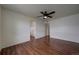 Bedroom features hardwood floors, closet and ceiling fan at 19249 E 58Th Ave # D, Denver, CO 80249