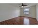 Bedroom with natural light, wood floors, and large window at 19249 E 58Th Ave # D, Denver, CO 80249