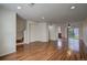 Open living room area with wood floors and recessed lighting at 19249 E 58Th Ave # D, Denver, CO 80249