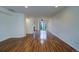 Spacious living room with beautiful laminate wood flooring, ceiling fan, and natural light at 19249 E 58Th Ave # D, Denver, CO 80249