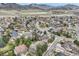 An aerial view of a community and the surrounding mountains at 5461 S Youngfield Ct, Littleton, CO 80127