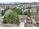 Aerial view of a home with a well-manicured lawn and a storage shed at 5461 S Youngfield Ct, Littleton, CO 80127