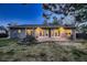 The home includes a patio with manicured landscaping at 5461 S Youngfield Ct, Littleton, CO 80127
