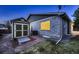 Fenced-in backyard with shed, patio, and grassy area at 5461 S Youngfield Ct, Littleton, CO 80127
