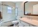 Bright bathroom with a shower and tub, vanity with sink, large mirror, and tile flooring at 5461 S Youngfield Ct, Littleton, CO 80127