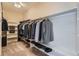 Spacious walk-in closet features custom shelving and ample storage for clothes, shoes, and accessories at 5461 S Youngfield Ct, Littleton, CO 80127