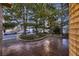 Front yard featuring mature landscaping, decorative rock and stamped concrete at 5461 S Youngfield Ct, Littleton, CO 80127