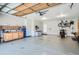 Clean two-car garage with workbench, pegboard, and plenty of room for vehicles and projects at 5461 S Youngfield Ct, Littleton, CO 80127