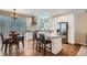 Kitchen with island, stainless appliances, granite countertops, and decorative glass block window at 5461 S Youngfield Ct, Littleton, CO 80127