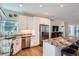 Bright kitchen featuring stainless steel appliances, granite countertops, island with seating at 5461 S Youngfield Ct, Littleton, CO 80127