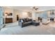 Open concept living area with plush carpet flowing into the adjacent dining and kitchen areas at 5461 S Youngfield Ct, Littleton, CO 80127