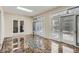 Bright sunroom with tile flooring, multiple glass doors, and a skylight for ample natural light at 5461 S Youngfield Ct, Littleton, CO 80127