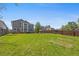 Picture of large backyard surrounded by a wood fence and vibrant green grass at 1716 W Sunset St, Longmont, CO 80501