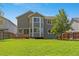 Expansive backyard featuring a large deck and well-maintained lawn at 1716 W Sunset St, Longmont, CO 80501
