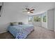 Bright Primary bedroom with multiple windows and a ceiling fan at 1716 W Sunset St, Longmont, CO 80501