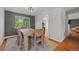 Cozy dining room featuring hardwood floors, a wooden table and natural light from the window at 1716 W Sunset St, Longmont, CO 80501