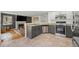 Modern kitchen with granite countertops, stainless steel appliances, and views of the living space at 1716 W Sunset St, Longmont, CO 80501