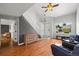 Spacious living room featuring hardwood floors, a staircase and comfortable seating at 1716 W Sunset St, Longmont, CO 80501