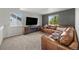 Upstairs living room with an entertainment center, a fireplace and cozy sofas at 1716 W Sunset St, Longmont, CO 80501