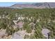 Aerial view of the neighborhood and mountain range in the distance at 670 Independence Dr, Larkspur, CO 80118