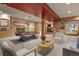 Spacious basement with stone accents, fireplace, and pool table area for entertaining guests at 670 Independence Dr, Larkspur, CO 80118