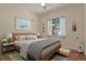 Bright bedroom with neutral colors, a large window, and cozy decor, perfect for relaxation at 670 Independence Dr, Larkspur, CO 80118