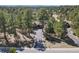 A beautiful exterior view with a driveway and trees at 670 Independence Dr, Larkspur, CO 80118