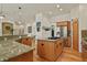 Gourmet kitchen with granite countertops, stainless steel appliances and custom cabinets at 670 Independence Dr, Larkspur, CO 80118