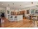 Open kitchen with a breakfast bar, stainless steel appliances, and modern pendant lighting at 670 Independence Dr, Larkspur, CO 80118