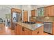 Gourmet kitchen with granite countertops and stainless steel appliances with a view to the window at 670 Independence Dr, Larkspur, CO 80118