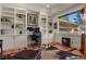 Bright office featuring custom built-ins, a large window and hardwood floors at 670 Independence Dr, Larkspur, CO 80118