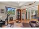 A home office featuring a vintage cabinet and a view of the outdoors at 670 Independence Dr, Larkspur, CO 80118
