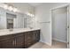 Modern bathroom with double vanity, large mirrors, and stylish fixtures at 6881 Oak Canyon Cir, Castle Pines, CO 80108