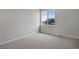 Carpeted bedroom with base trim and large window at 6881 Oak Canyon Cir, Castle Pines, CO 80108