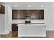 A kitchen with shaker cabinets, white subway tile backsplash, and stainless steel appliances at 6881 Oak Canyon Cir, Castle Pines, CO 80108
