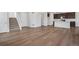 Open living space showcasing hardwood floors and seamless transition to a modern kitchen at 6881 Oak Canyon Cir, Castle Pines, CO 80108
