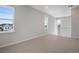 Open loft area with neutral carpet, natural light, and views of the outdoors at 6881 Oak Canyon Cir, Castle Pines, CO 80108