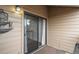 View of a private balcony with outdoor seating and sliding door access from the interior at 218 Wright St # 303, Lakewood, CO 80228