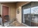 Balcony with outdoor seating, featuring a sliding door, and an ornamental water fountain on the siding at 218 Wright St # 303, Lakewood, CO 80228