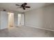 Bedroom featuring a ceiling fan, carpeted floors, walk-in closet and adjacent bathroom at 218 Wright St # 303, Lakewood, CO 80228