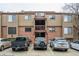 Exterior of a multi-story brick apartment building with ample parking and a welcoming facade at 218 Wright St # 303, Lakewood, CO 80228