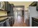 View from the kitchen looking towards the living room with stone fireplace at 218 Wright St # 303, Lakewood, CO 80228