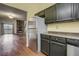 View from the kitchen looking towards the living room with stone fireplace at 218 Wright St # 303, Lakewood, CO 80228