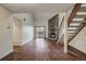 Spacious living room featuring hardwood floors, a stone fireplace, and access to a balcony at 218 Wright St # 303, Lakewood, CO 80228