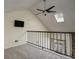 Loft area features a ceiling fan, skylight, and a view of the living room at 218 Wright St # 303, Lakewood, CO 80228