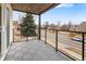 Private balcony with gray composite decking, offering a street view at 2664 S Cherokee St, Denver, CO 80223